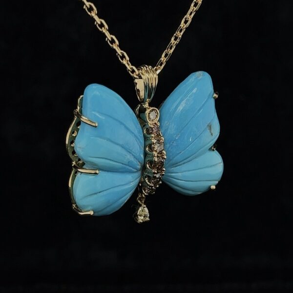 Colgante mariposa con turquesa y diamantes